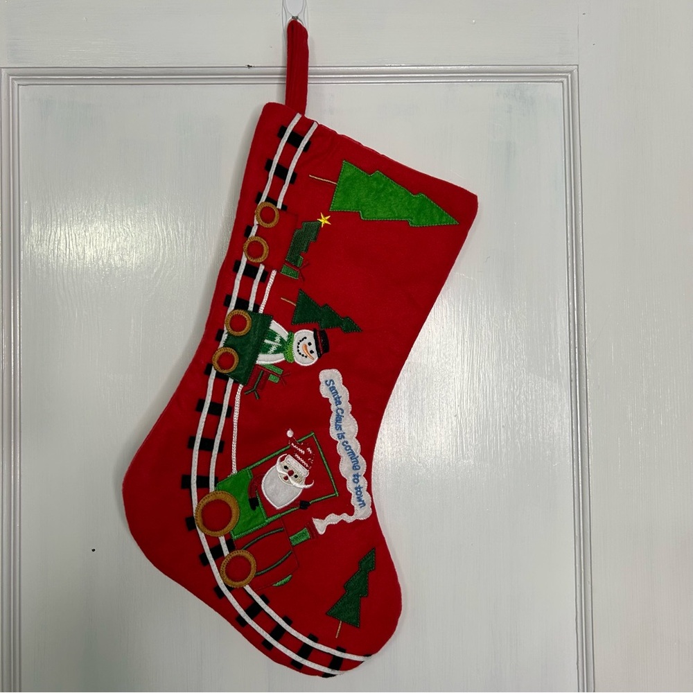 Santa Claus is Coming to Town 
Red Christmas Stocking with Santa and Snowman.